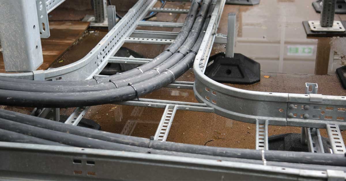 What is the difference between cable ladders and cable trays