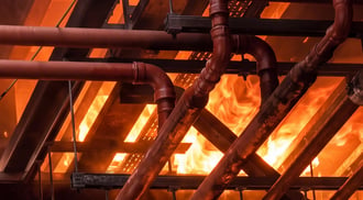 Building services and supporting steelwork shown against flames in the MIDFIX FRS booklet.