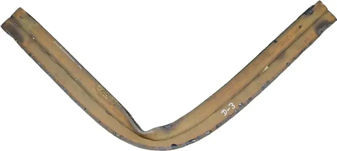 A channel section deformed after fire exposure