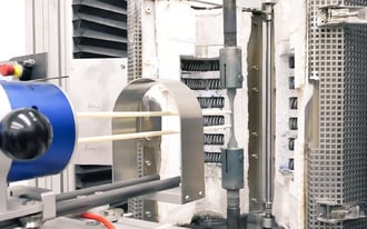 Channel section positioned inside a test rig.